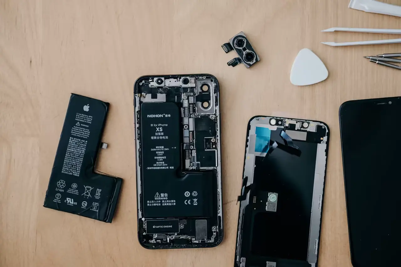 a disassembled phone being repaired